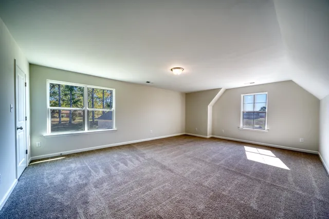 a bathroom with a tub sink shower and mirror