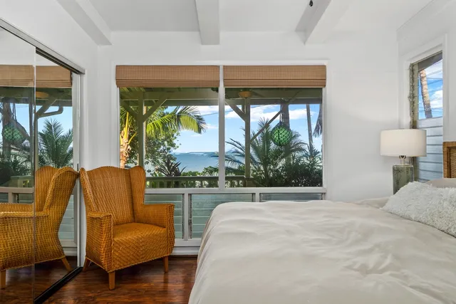 a bedroom with furniture and a window