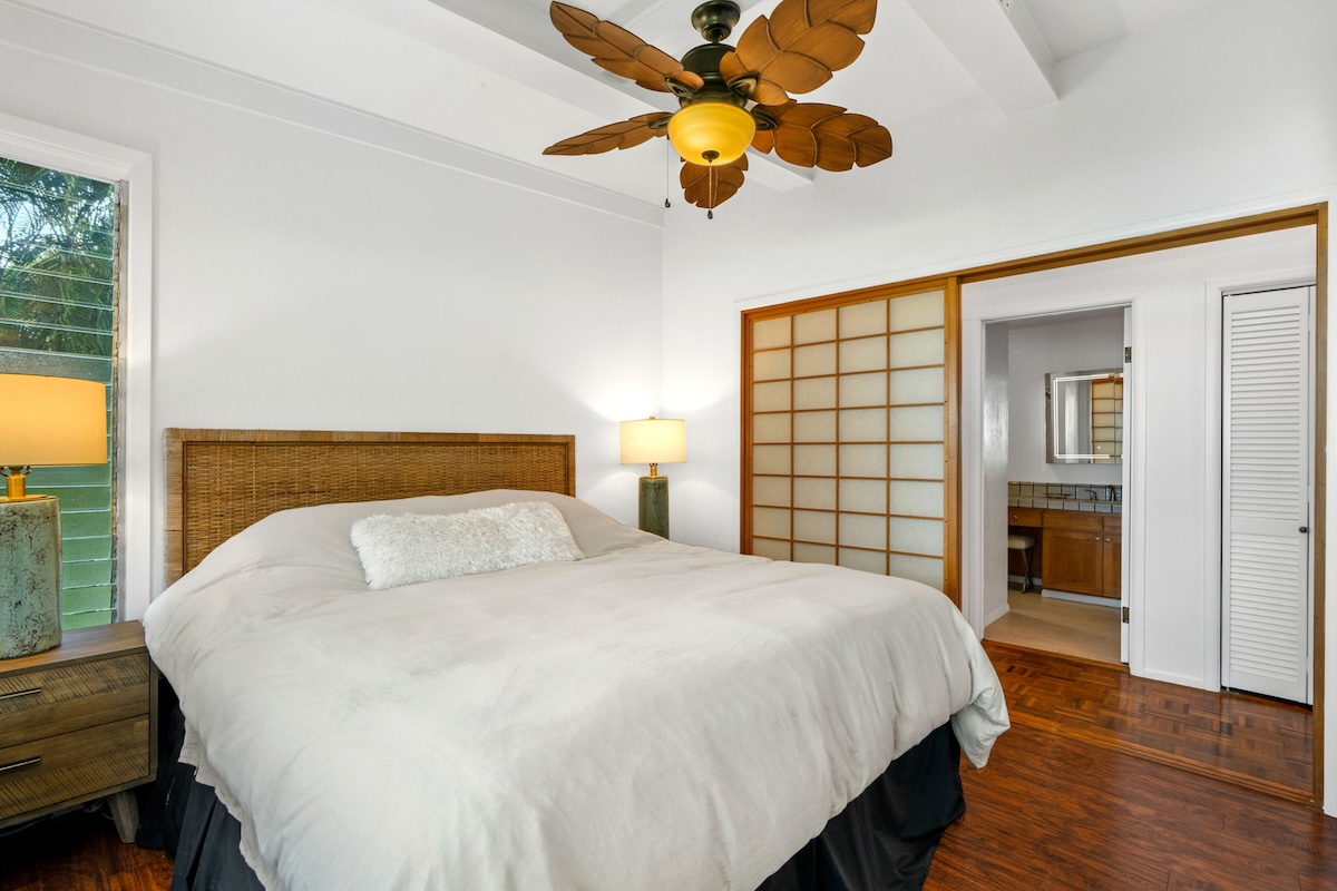 4271 Anini Road Princeville, HI 96722 - Photo 13 of 24 a bedroom with a bed and window