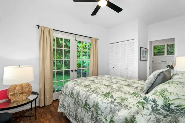 a bedroom with a bed and chair