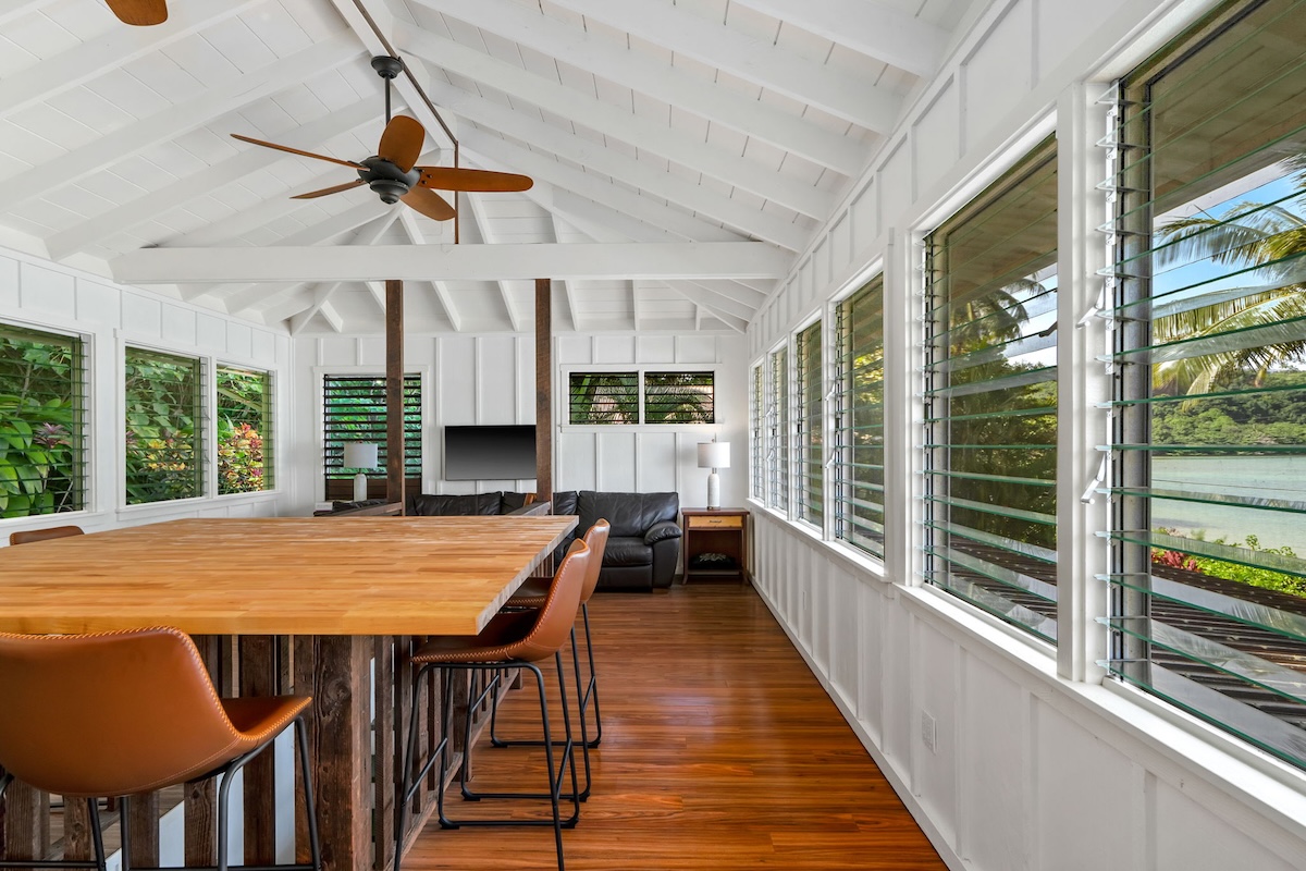 4271 Anini Road Princeville, HI 96722 - Photo 17 of 24 a dining room with furniture and wooden floor