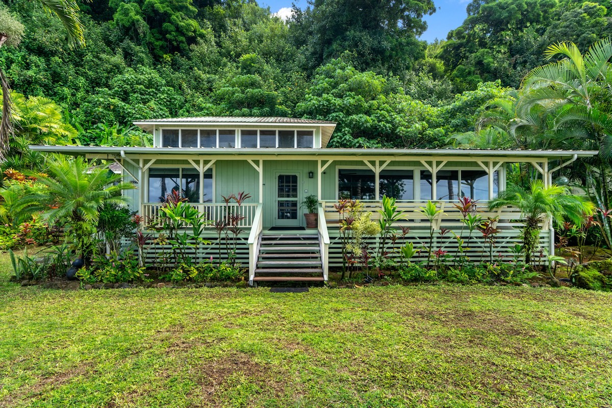 4271 Anini Road Princeville, HI 96722 - Photo 2 of 24 a view of a house with a yard