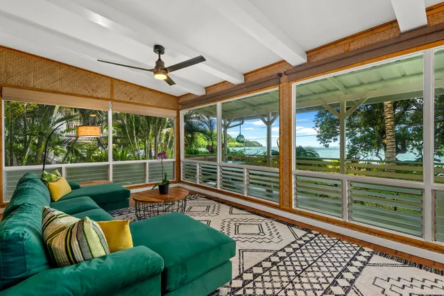 a balcony with furniture and a garden