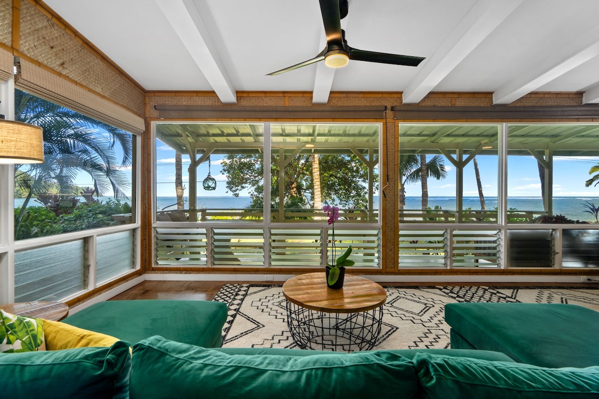 4271 Anini Road Princeville, HI 96722 - Photo 5 of 24 a view of a porch with furniture and a yard