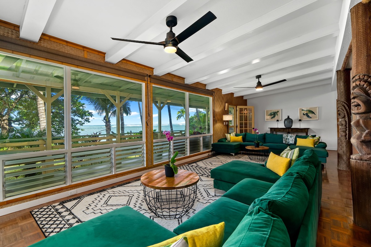4271 Anini Road Princeville, HI 96722 - Photo 6 of 24 a living room with furniture a rug and a large window