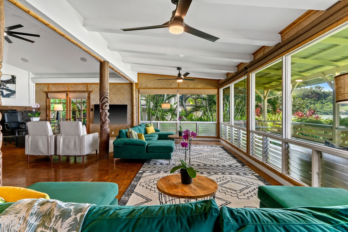 4271 Anini Road Princeville, HI 96722 - Photo 7 of 24 a living room with patio furniture and a floor to ceiling window