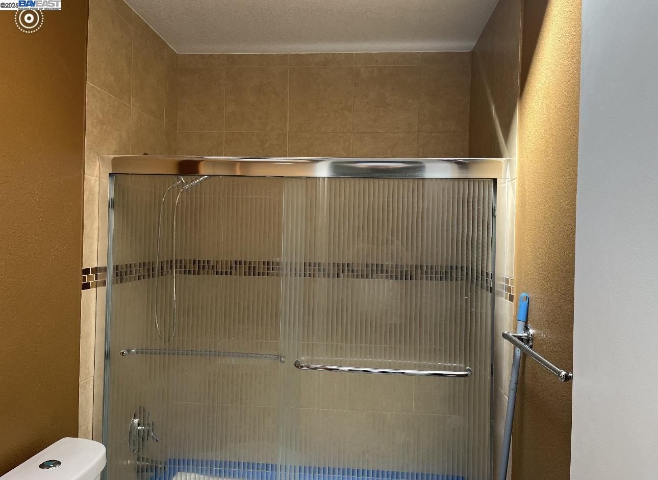 117 Day Street, Unit 204 San Francisco, CA 94131 - Photo 10 of 20 a bathroom with a glass shower door