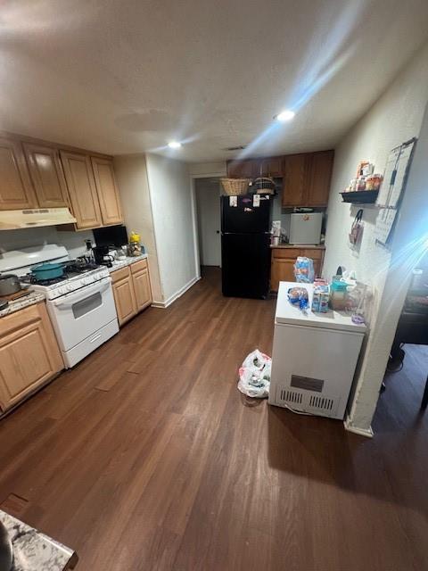 1934 Calypso Street Dallas, TX 75212 - Photo 4 of 11 a kitchen with kitchen island wooden floors appliances and furniture