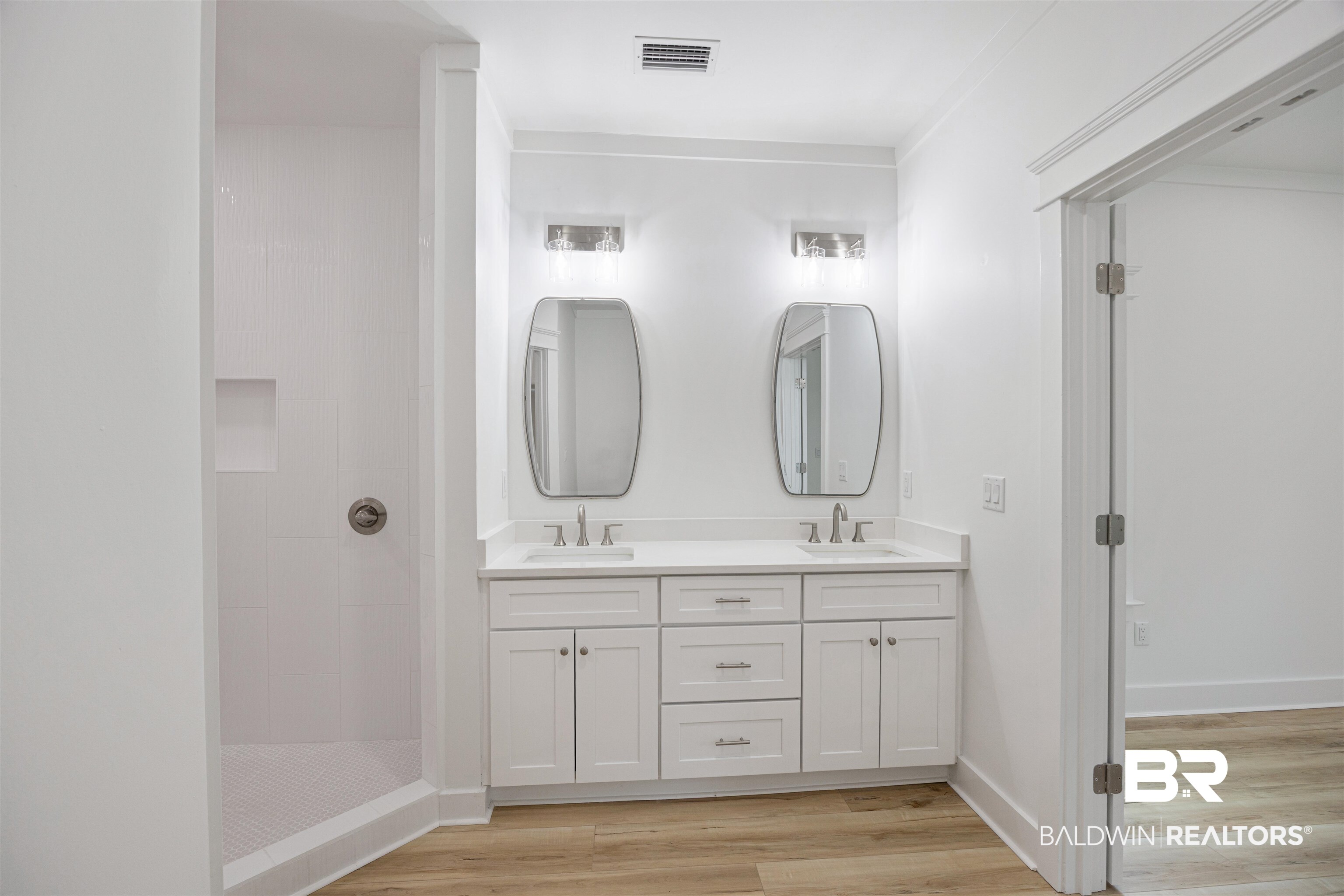 27591 Canal Road Orange Beach, AL 36561 - Photo 24 of 51 Bathroom featuring walk in shower, double vanity, and light wood-style floors