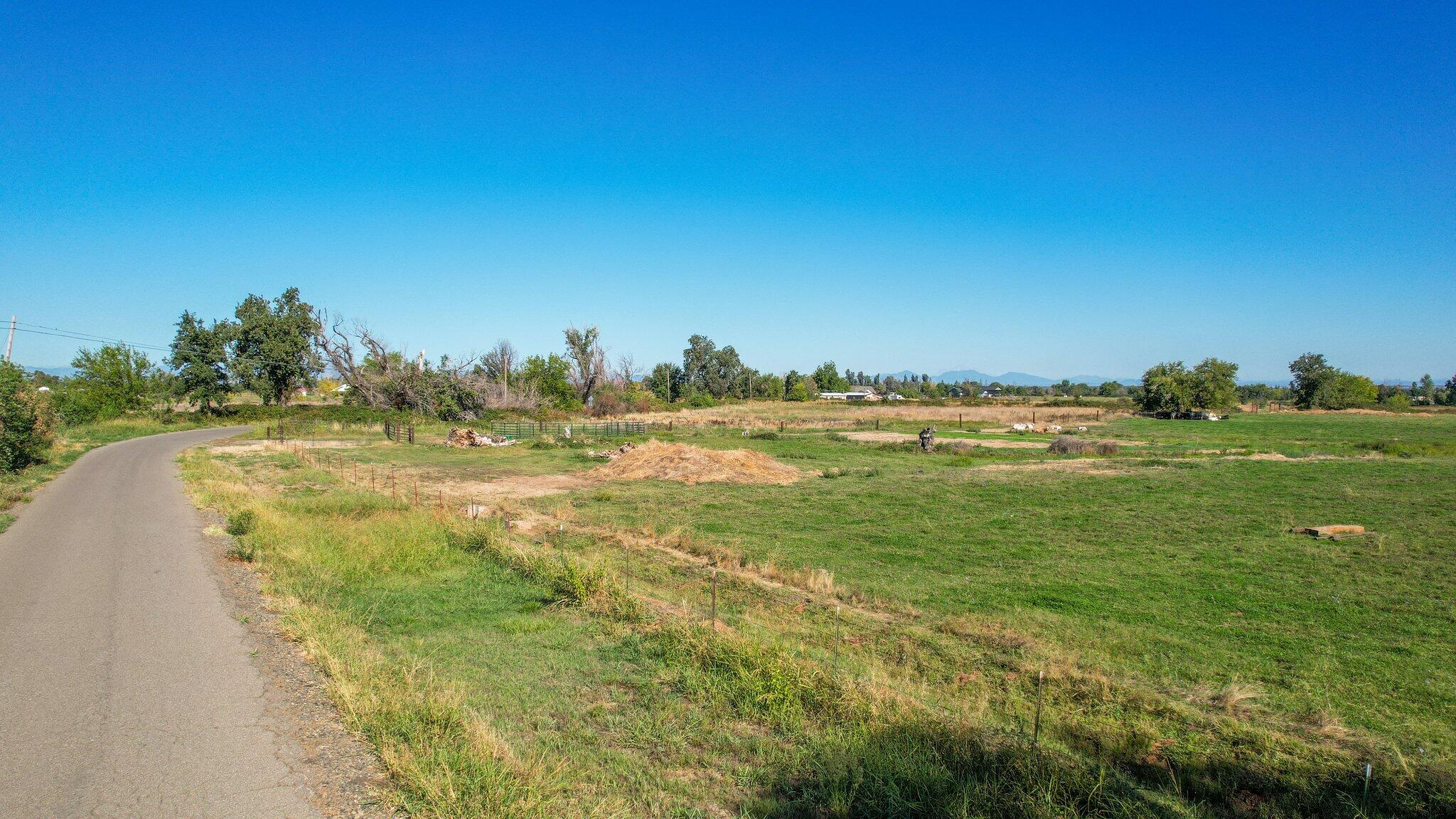 Webb Road Anderson, CA 96007 - Photo 5 of 20 a view of a field with an ocean and trees