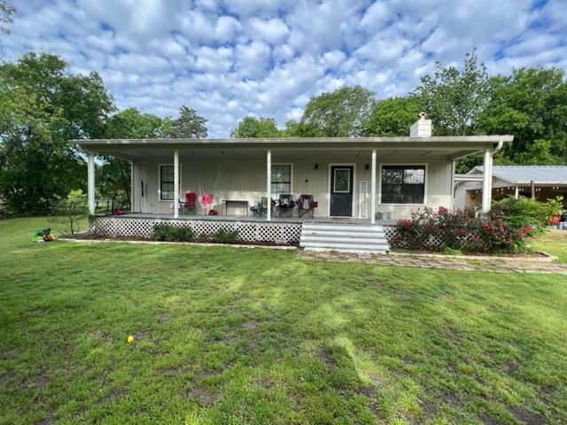 201 Northeast 10th Street Cooper, TX 75432 - Photo 1 of 1 front view of a house with a yard