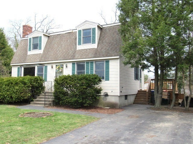 83 Chippy Lane Methuen, MA 01844 - Photo 18 of 19 a front view of a house with a garden