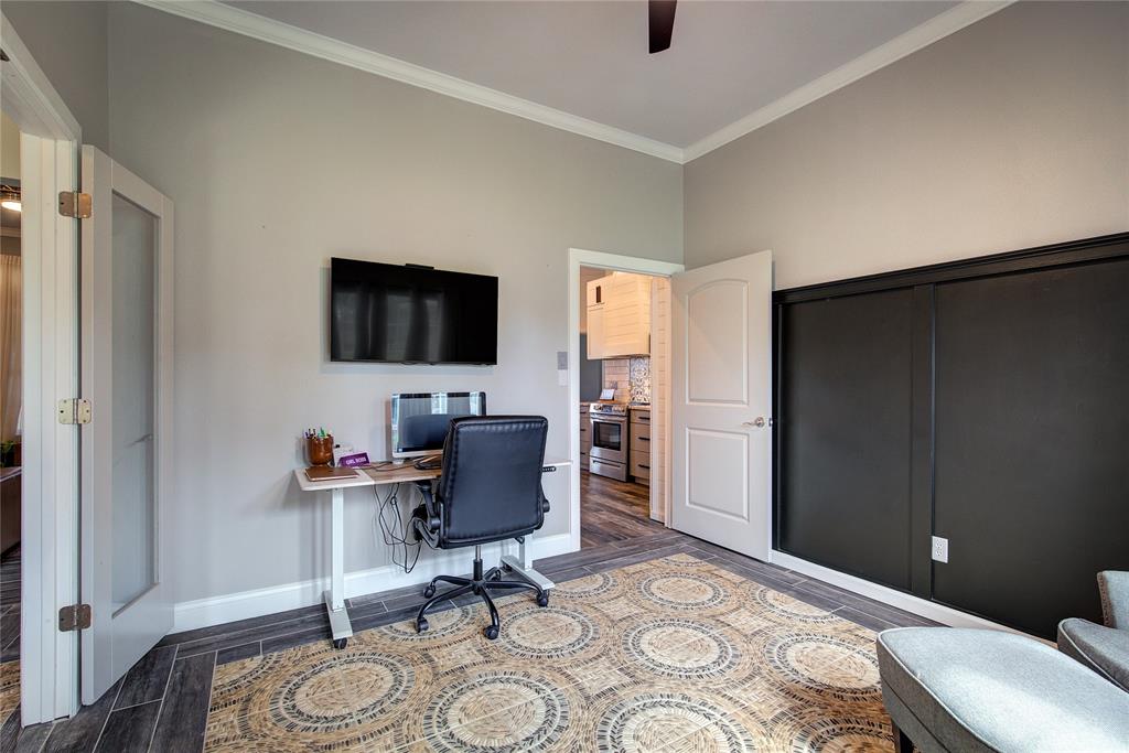 2027 Park Springs Road Sulphur Springs, TX 75482 - Photo 7 of 39 a view of a workspace with furniture and a window