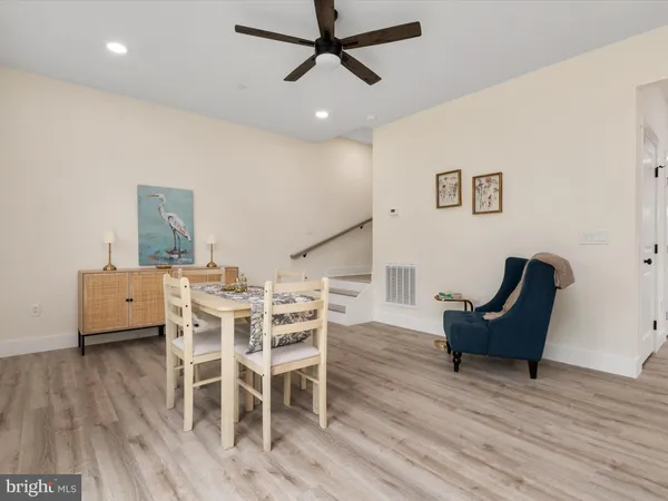 a view of a livingroom with furniture and wooden floor