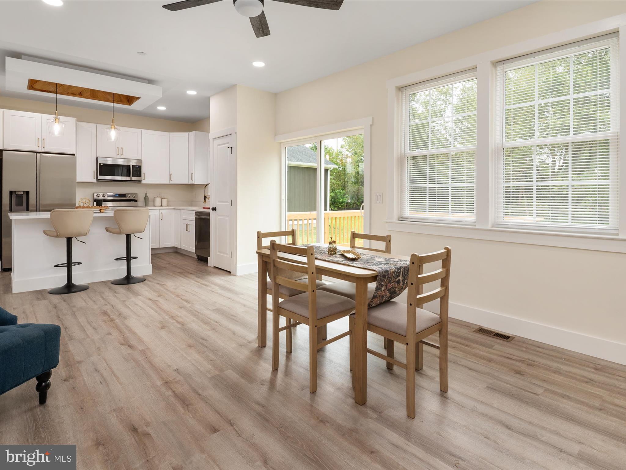 1 Sunrise Avenue Ridgely, MD 21660 - Photo 14 of 28 a view of a dining room with furniture and wooden floor