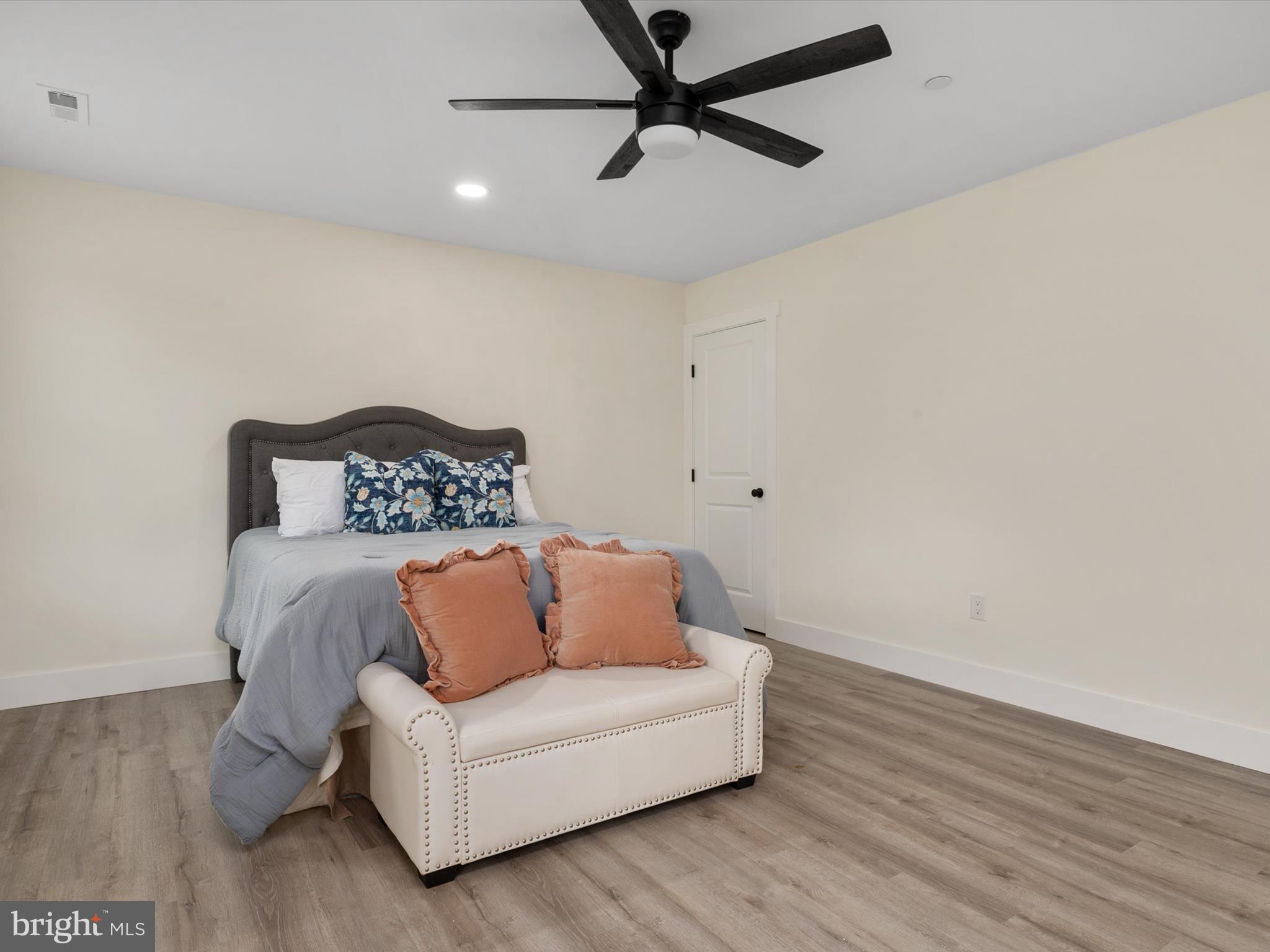 1 Sunrise Avenue Ridgely, MD 21660 - Photo 18 of 28 a living room with furniture and a wooden floor