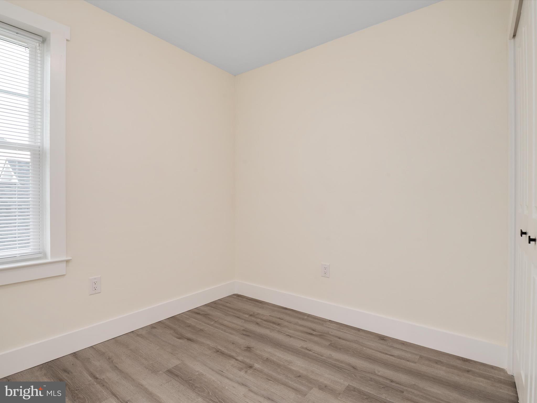 1 Sunrise Avenue Ridgely, MD 21660 - Photo 21 of 28 a view of an empty room with wooden floor and a window