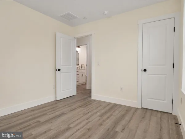 an empty room with wooden floor