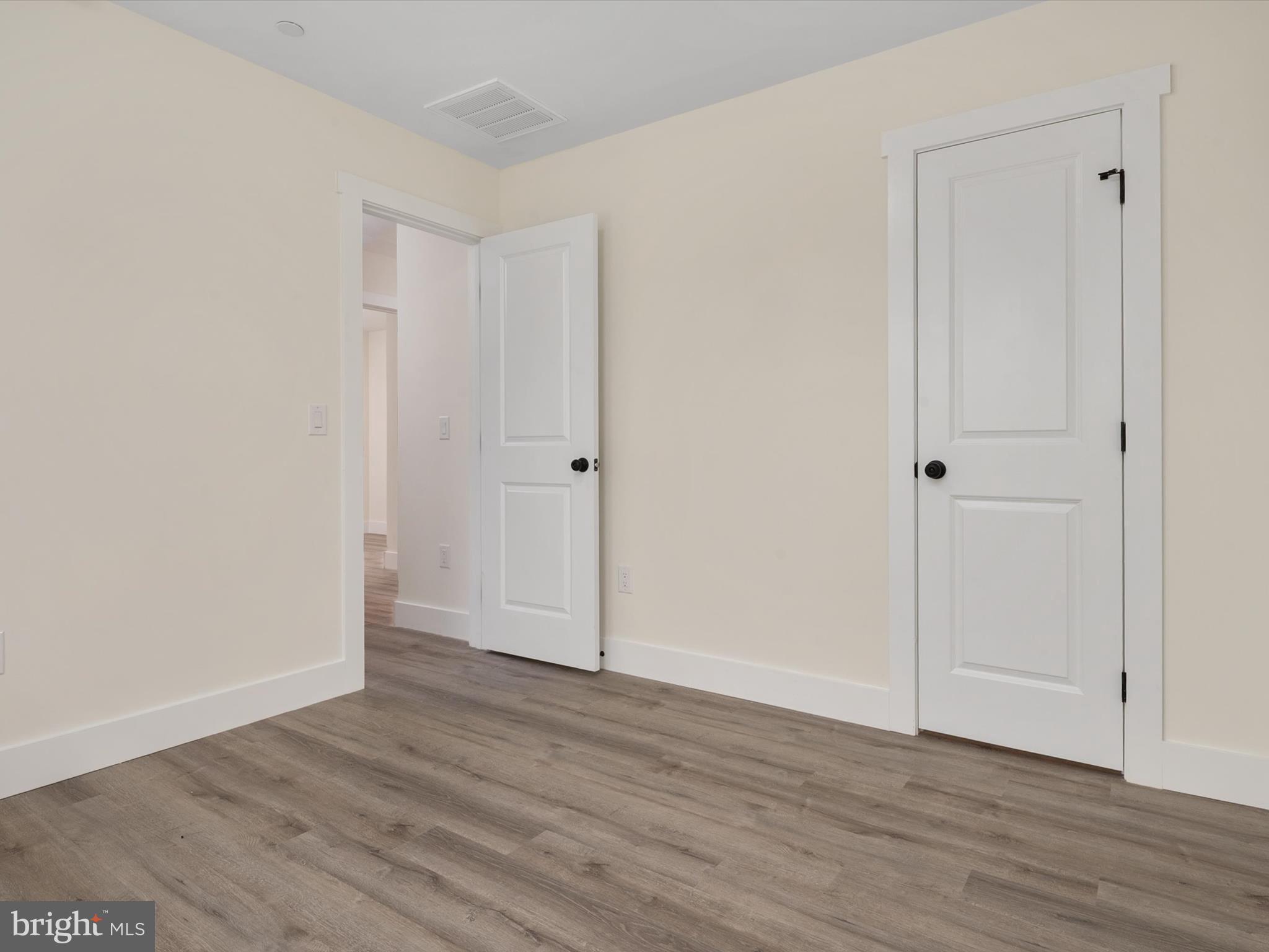 1 Sunrise Avenue Ridgely, MD 21660 - Photo 25 of 28 a view of an empty room with wooden floor