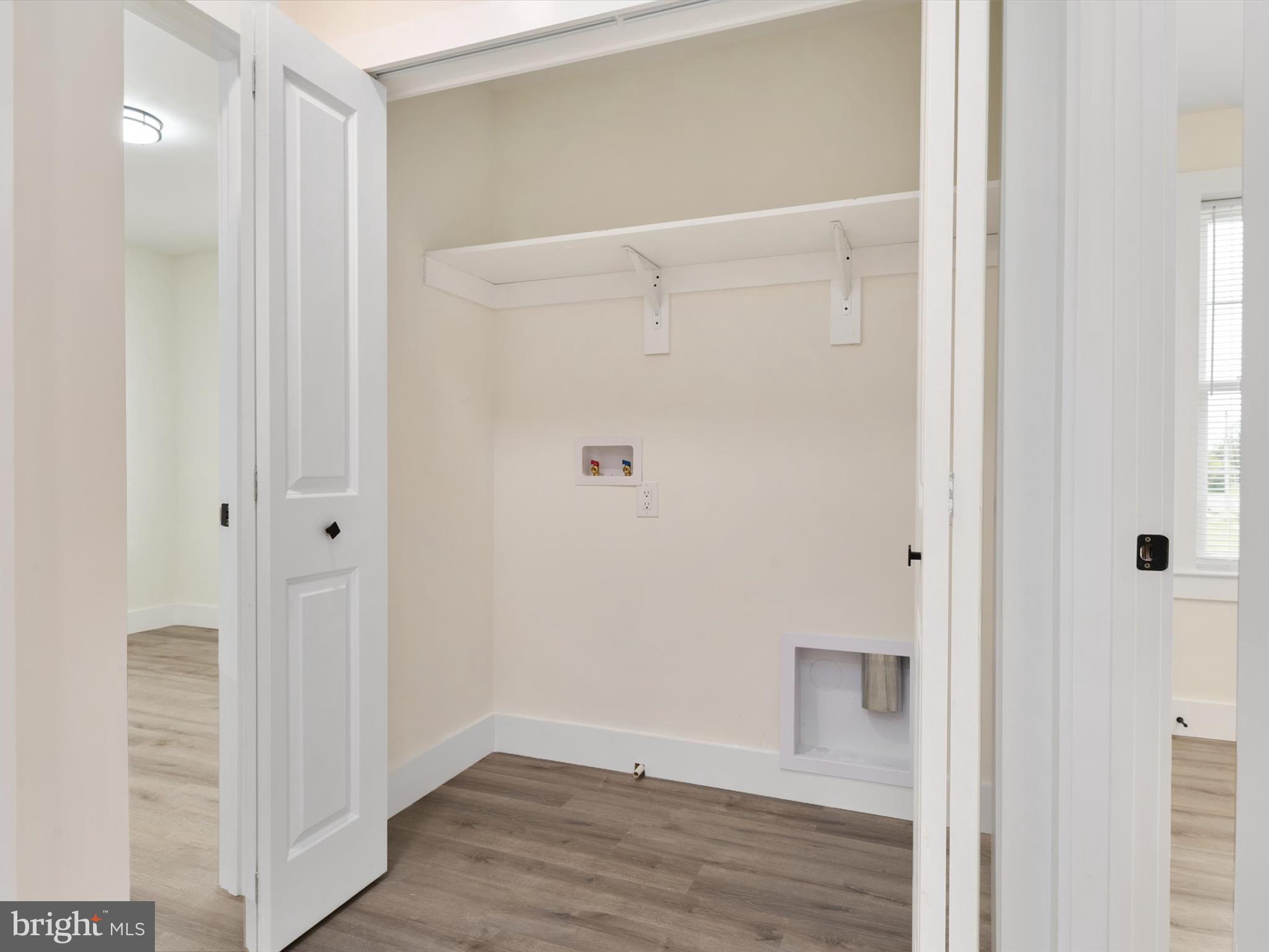 1 Sunrise Avenue Ridgely, MD 21660 - Photo 27 of 28 a view of a hallway with wooden floor