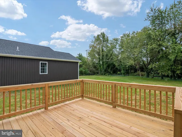 a view of deck with wooden floor and fence