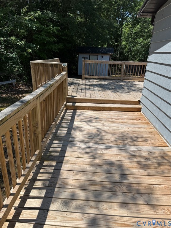 371 Horseshoe Road Jarratt, VA 23867 - Photo 4 of 21 a view of terrace with wooden floor and seating space