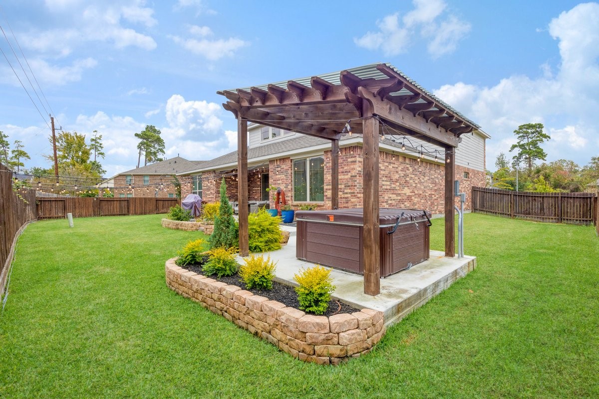 15815 Gibson Grass Court Spring, TX 77379 - Photo 22 of 25 a view of a house with a big yard potted plants and large tree