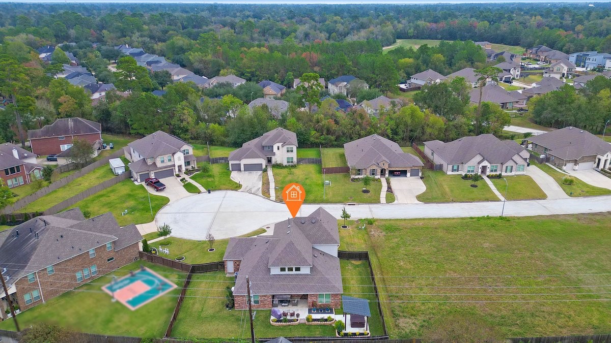 15815 Gibson Grass Court Spring, TX 77379 - Photo 23 of 25 an aerial view of residential houses with outdoor space and parking