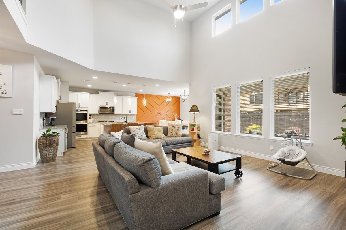 15815 Gibson Grass Court Spring, TX 77379 - Photo 6 of 25 a living room with furniture kitchen view and large windows