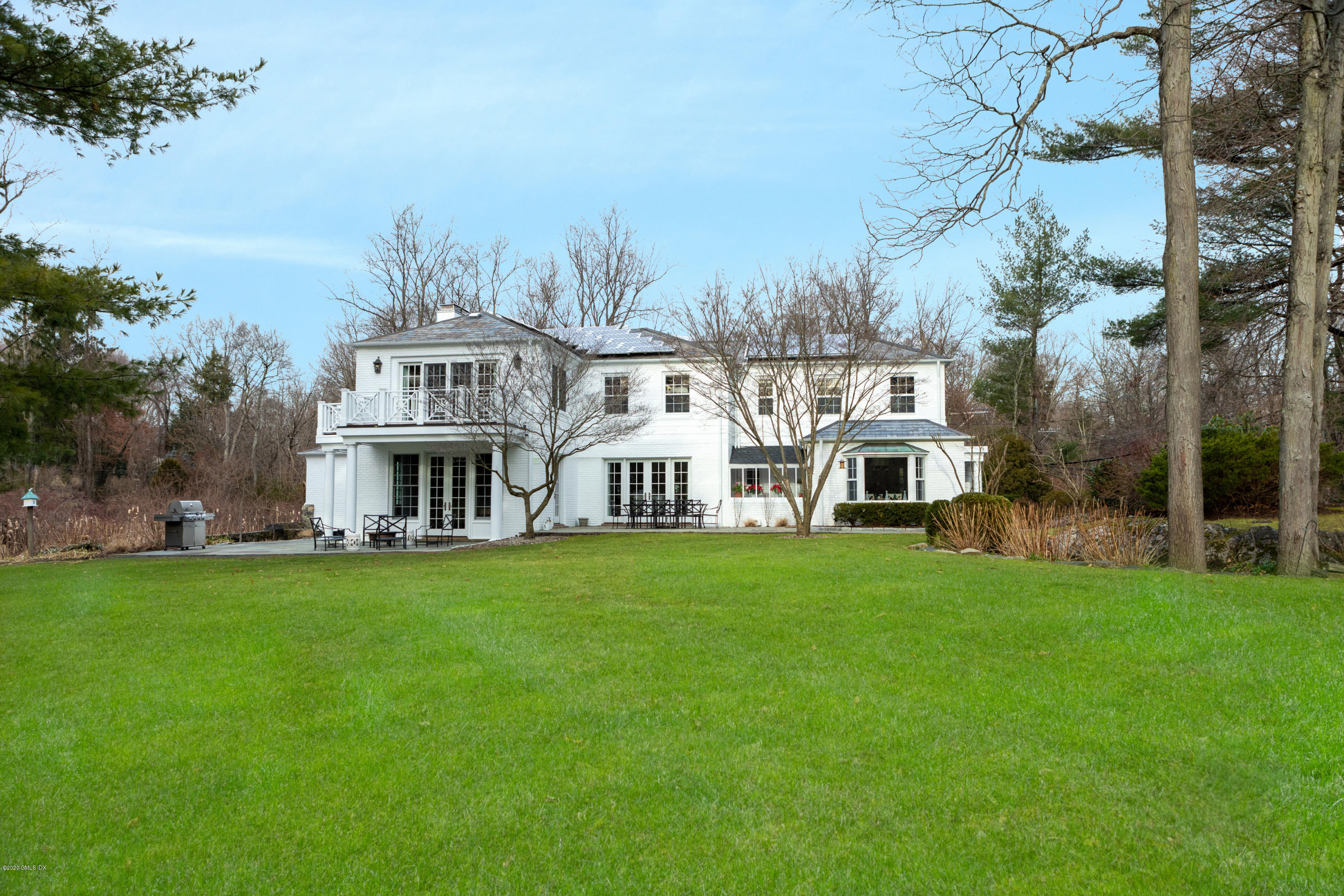 19 Dingletown Road Greenwich, CT 06830 - Photo 18 of 20 a front view of a house with a garden