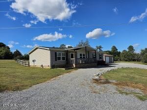 211 North Springview Road Maryville, TN 37801 - Photo 2 of 27 a front view of a house with a yard