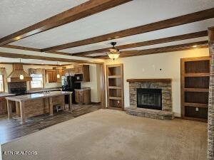 211 North Springview Road Maryville, TN 37801 - Photo 8 of 27 a view of a livingroom with fireplace cabinet and windows