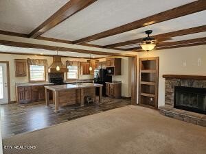 211 North Springview Road Maryville, TN 37801 - Photo 9 of 27 a living room with furniture a fireplace and kitchen view
