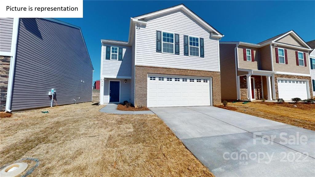 5038 Fandango Road York, SC 29745 - Photo 1 of 26 a front view of a house with a yard and garage