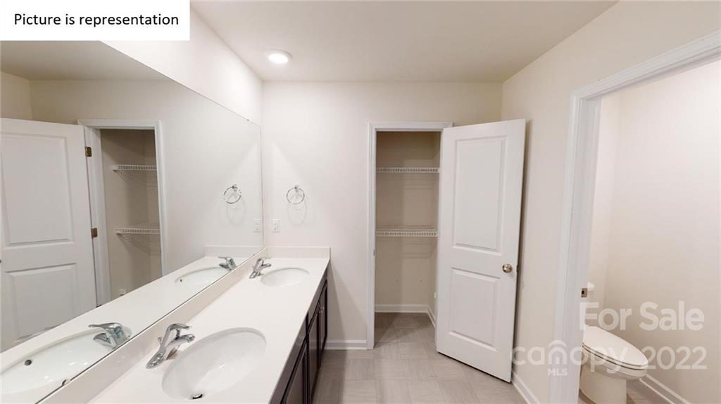 5038 Fandango Road York, SC 29745 - Photo 17 of 26 a bathroom with a sink and a mirror