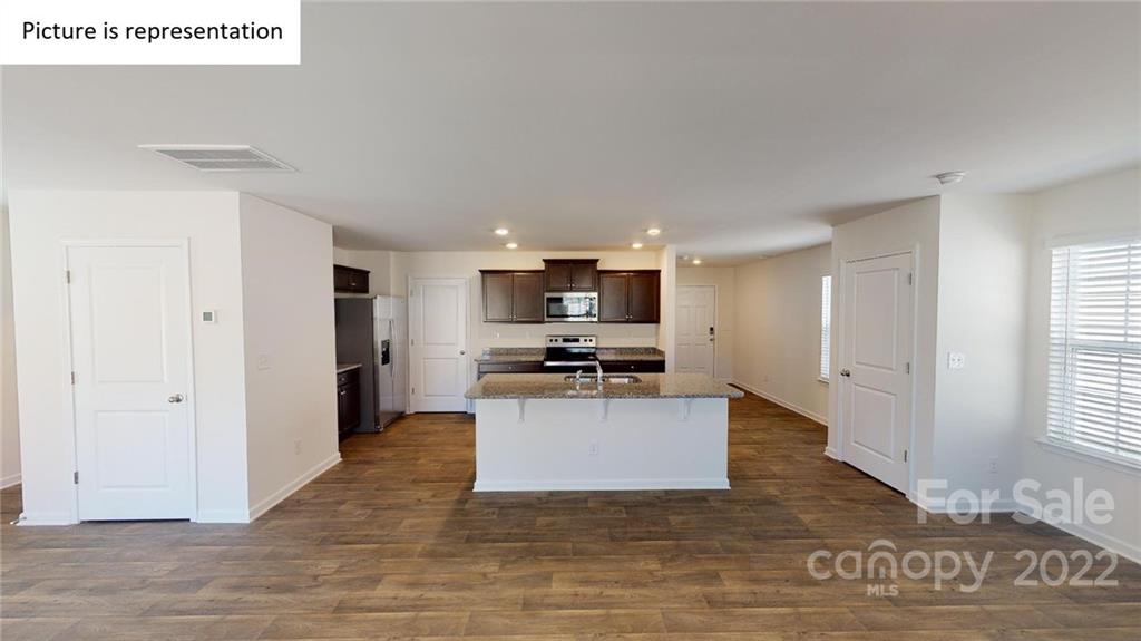 5038 Fandango Road York, SC 29745 - Photo 6 of 26 a view of kitchen with kitchen island stainless steel appliances a sink and refrigerator