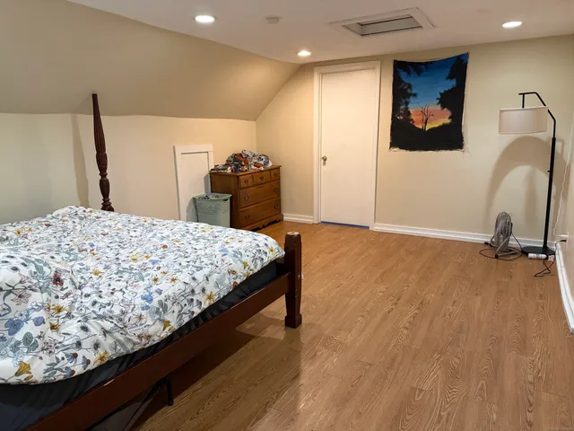 a bedroom with a bed and a sink