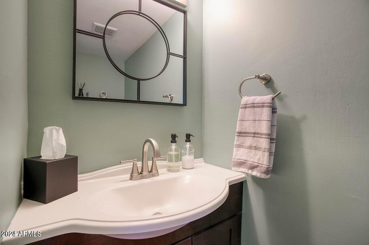6155 North Granite Reef Road Scottsdale, AZ 85250 - Photo 9 of 18 Downstairs powder room
