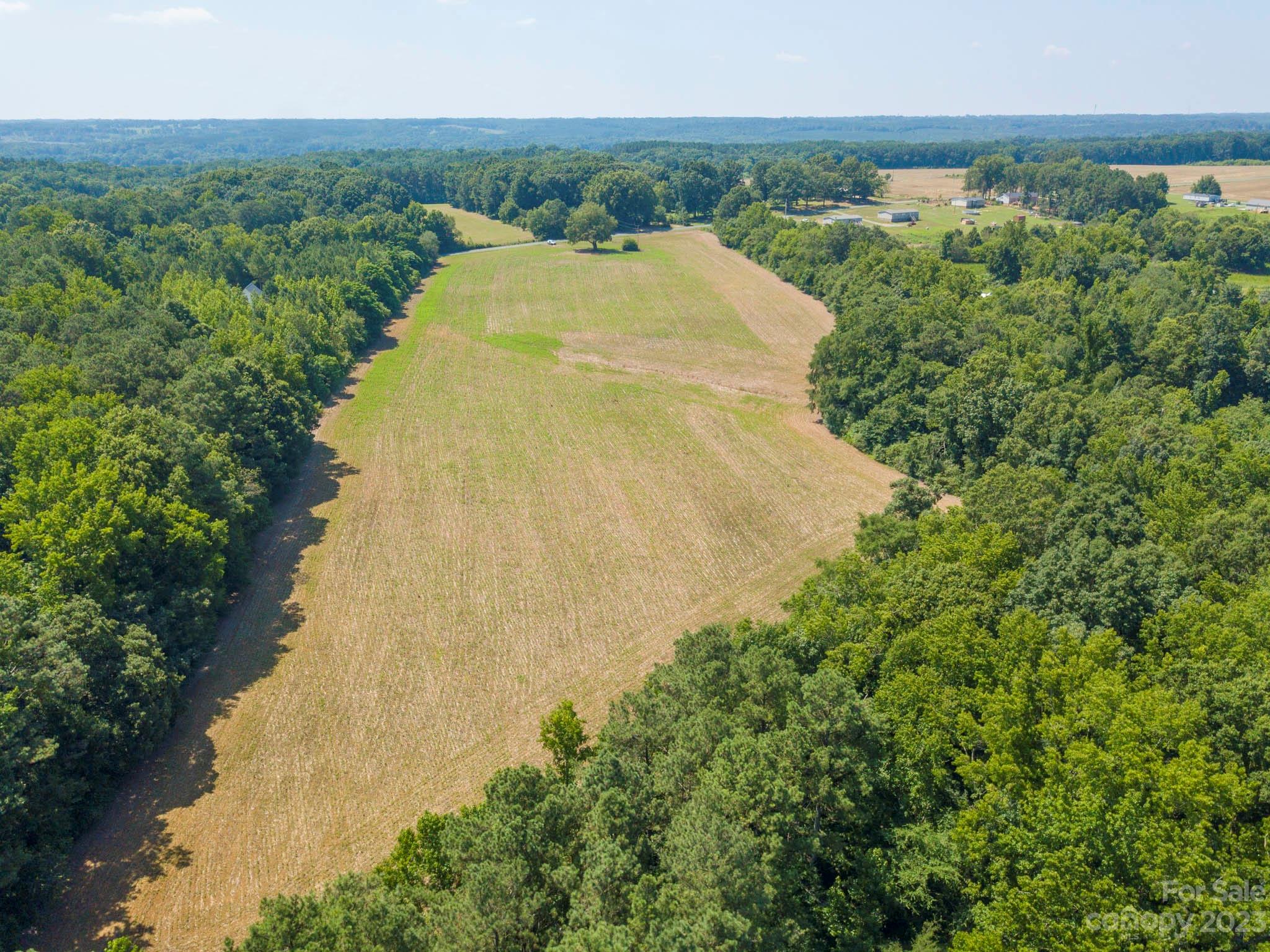 1 State Line Road, Unit 1 Marshville, NC 28103 - Photo 11 of 19 a view of a big yard with an outdoor space and seating area