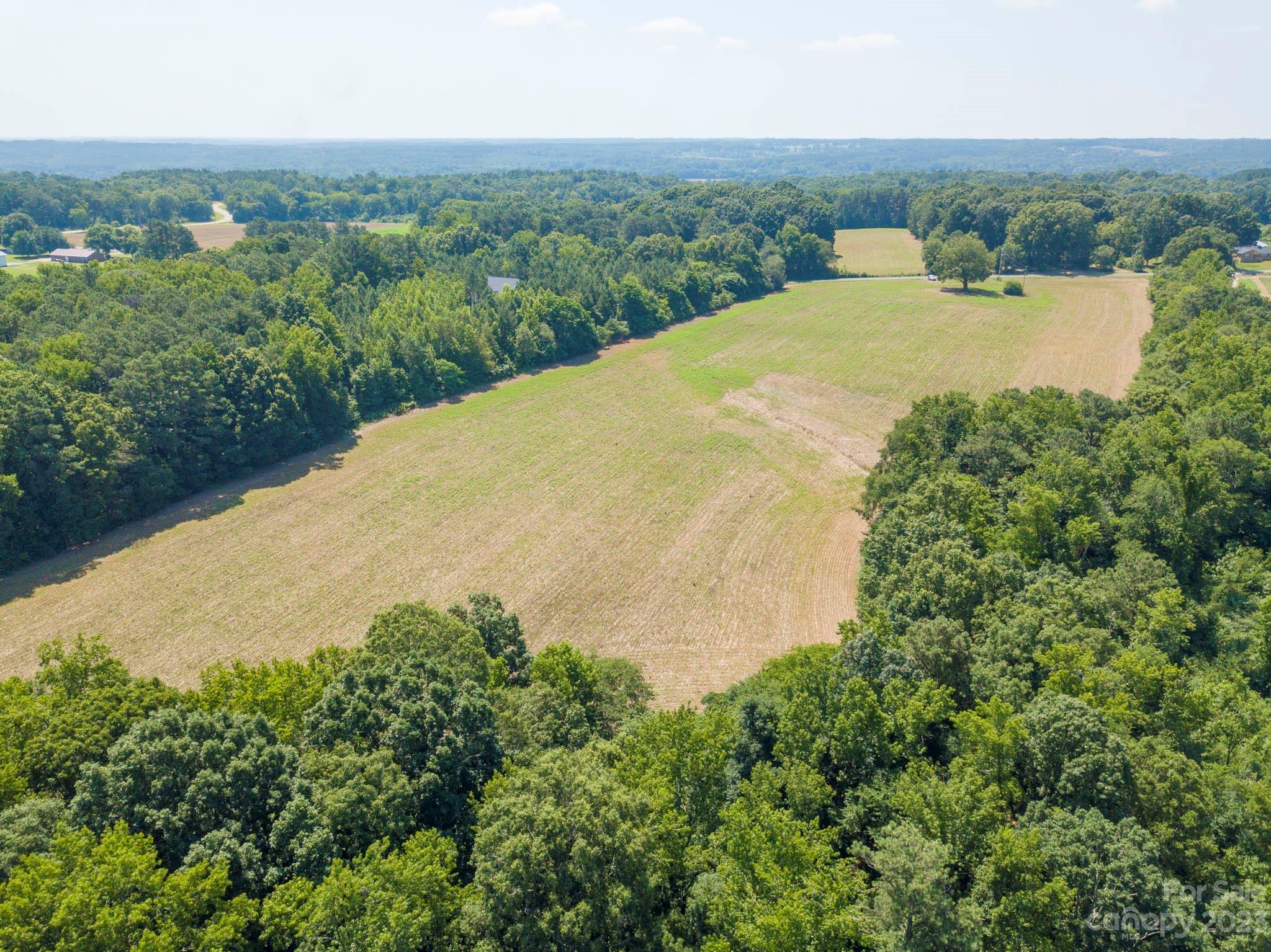 1 State Line Road, Unit 1 Marshville, NC 28103 - Photo 10 of 19 an aerial view of a house with a yard and lake view