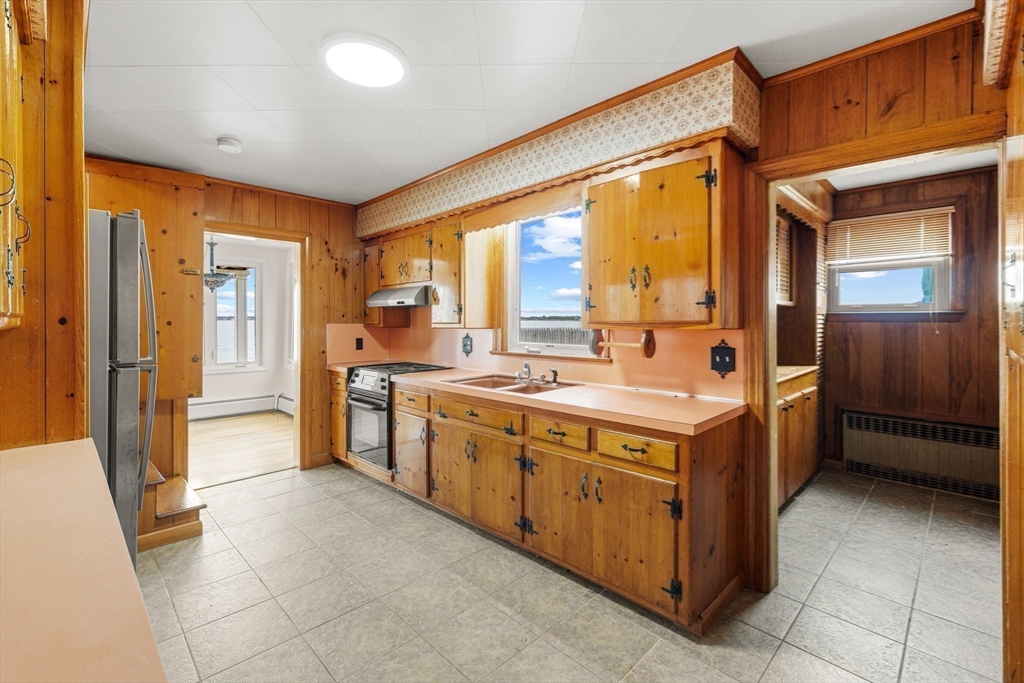 16 Reservation Road Fairhaven, MA 02719 - Photo 11 of 38 a large kitchen with a large window and a sink
