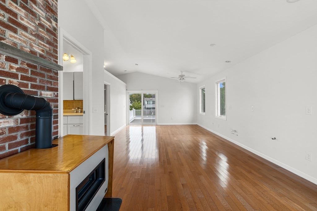 16 Reservation Road Fairhaven, MA 02719 - Photo 21 of 38 a view of a kitchen and an empty room with wooden floor