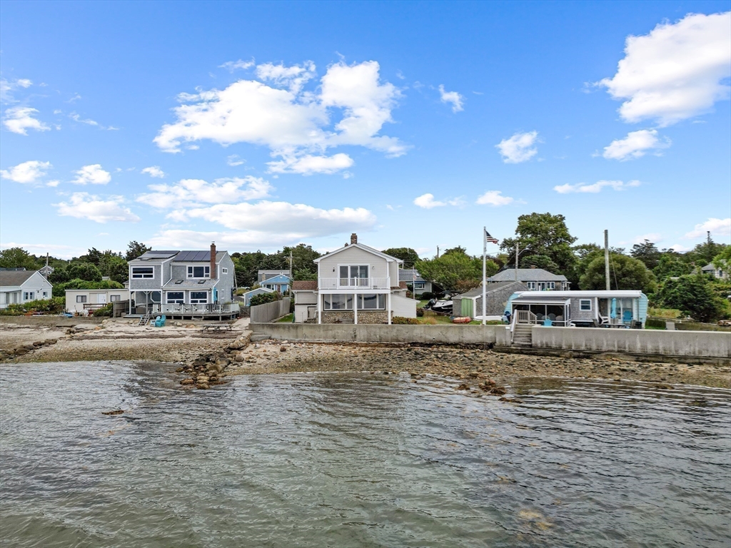 16 Reservation Road Fairhaven, MA 02719 - Photo 35 of 38 a view of a lake with a house