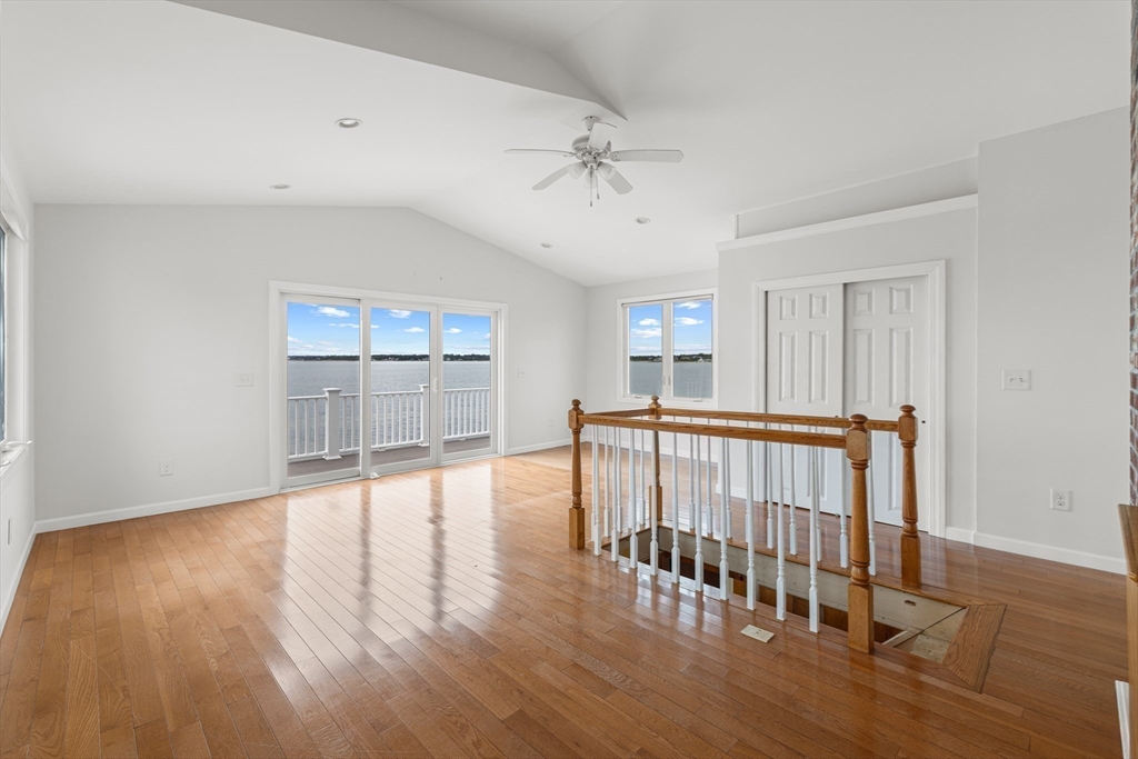 16 Reservation Road Fairhaven, MA 02719 - Photo 4 of 38 a view of an empty room with window and wooden floor