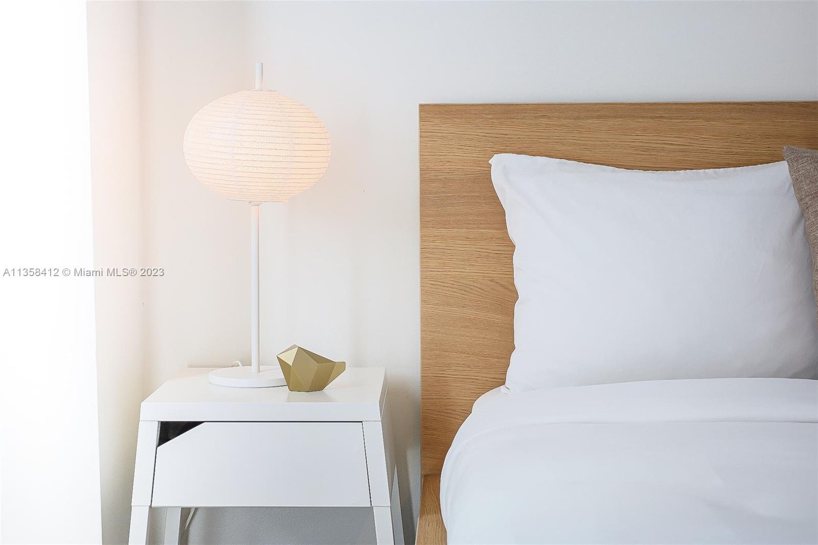 133 Northeast 2nd Avenue, Unit 1410 Miami, FL 33132 - Photo 15 of 25 a bathroom with a sink and a mirror