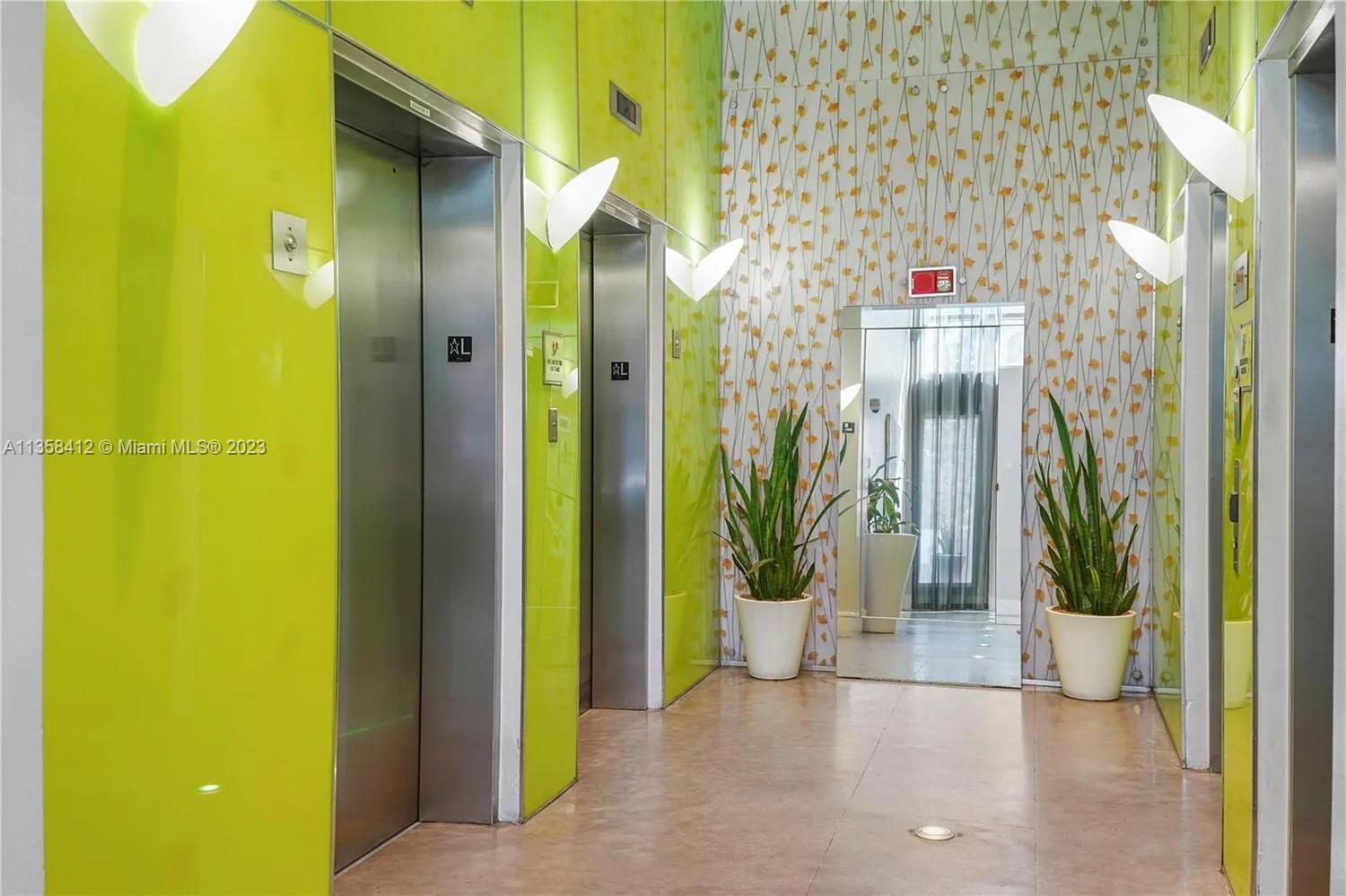 133 Northeast 2nd Avenue, Unit 1410 Miami, FL 33132 - Photo 21 of 25 a view of a bathroom with a glass door shower