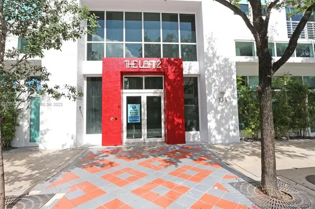 a building with trees in front of it