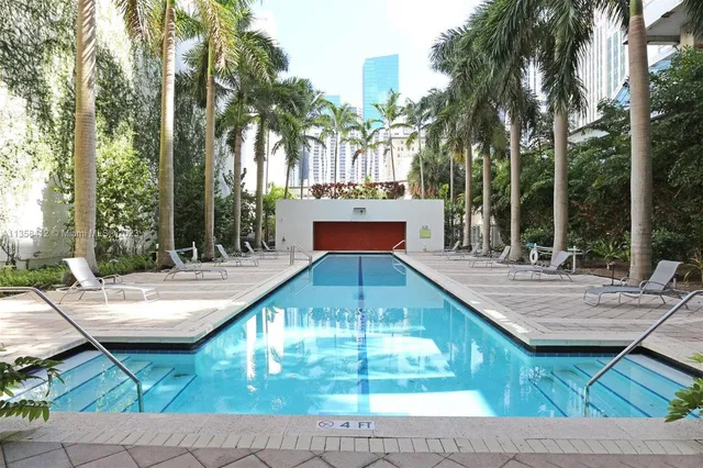 a view of swimming pool with a patio