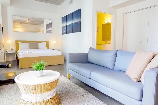 a living room with a couch and a table