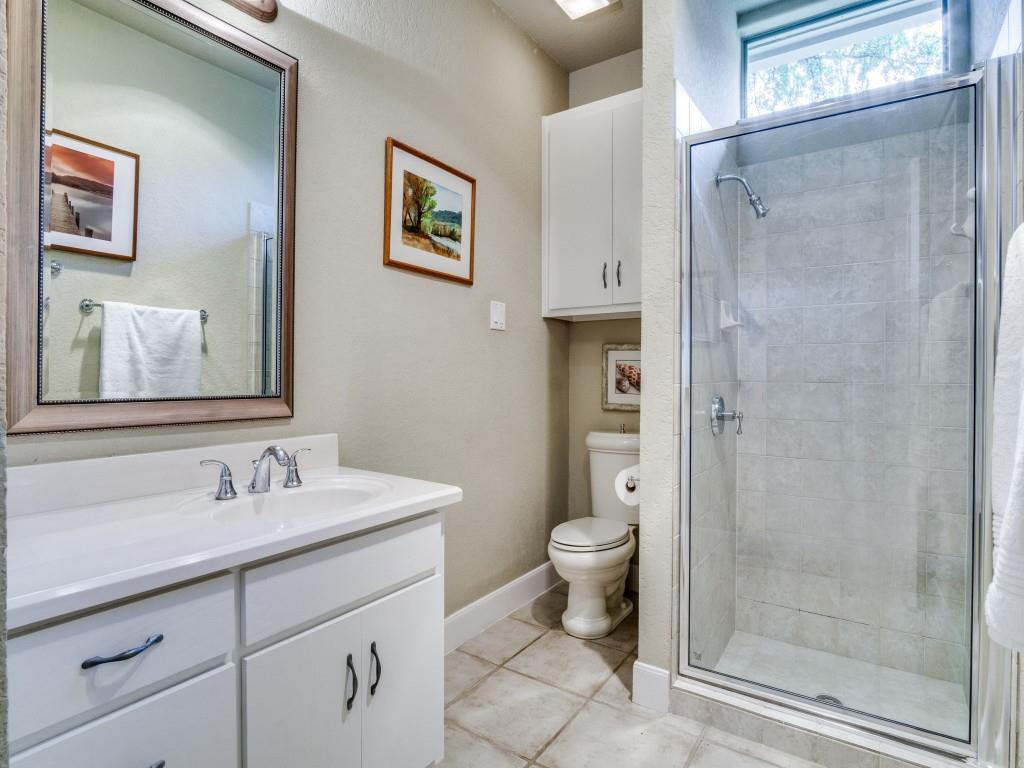 1014 Amanda Drive Mansfield, TX 76063 - Photo 21 of 40 a bathroom with a sink a toilet and shower